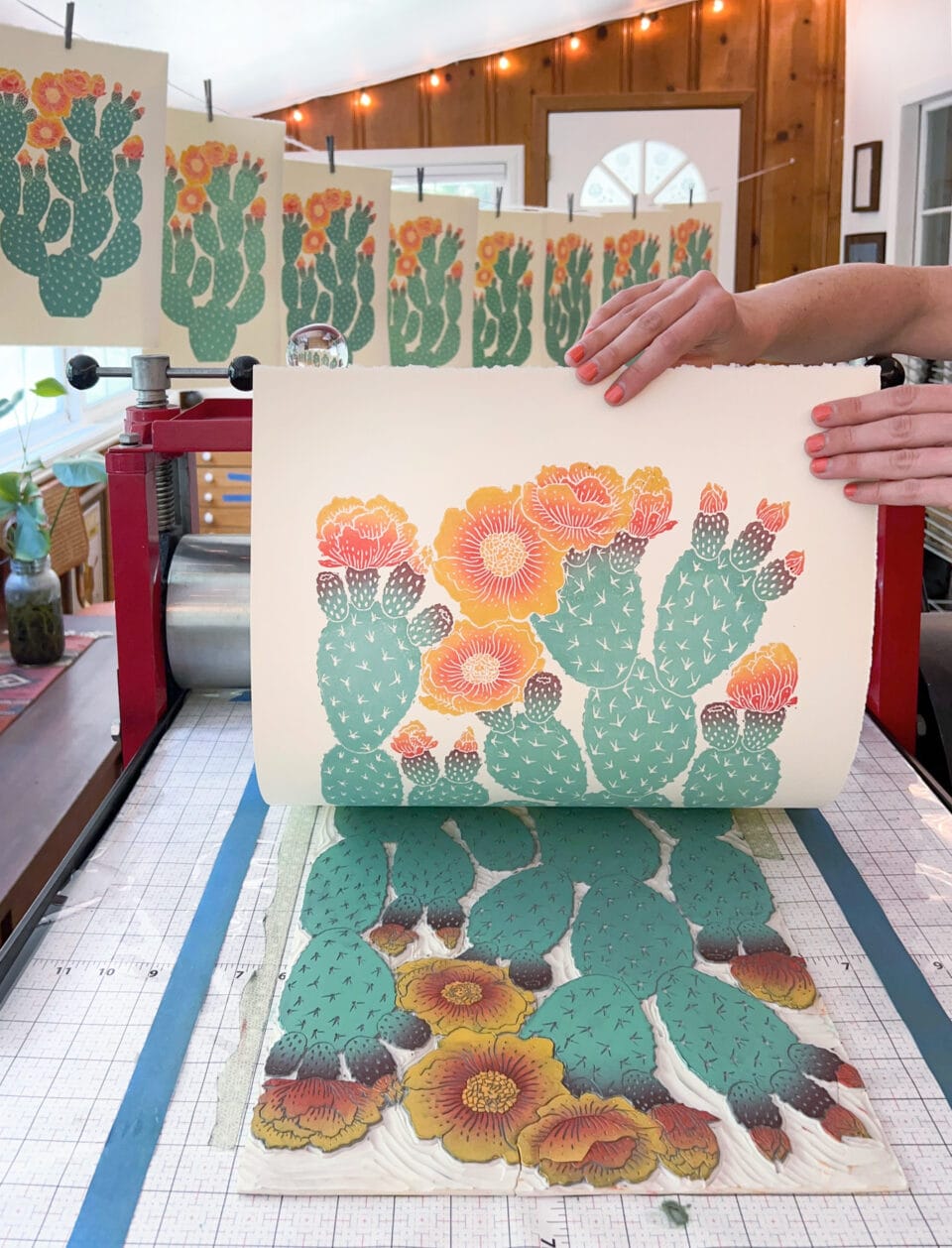 a block print of a prickly pear cactus being pulled