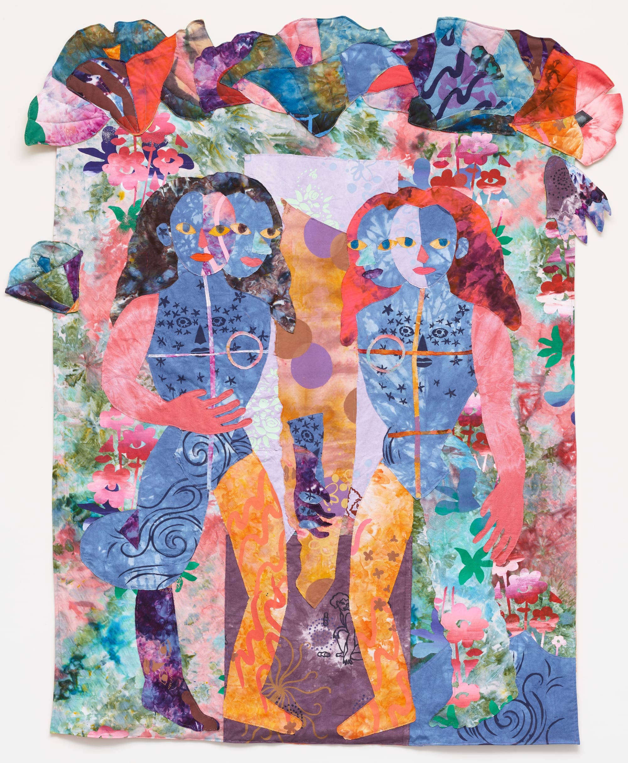 a textile portrait of two women in vivid, patterned fabrics